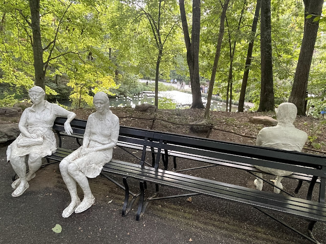 Three People on Four Benches Sculpture